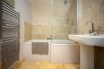 Ensuite to bedroom 2 with shower over bath