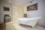 Beautiful free standing slipper bath in master bedroom