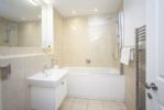 Large bathroom conveniently situated between both bedrooms