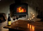 Enjoy a glass of wine around the real wood burning fire